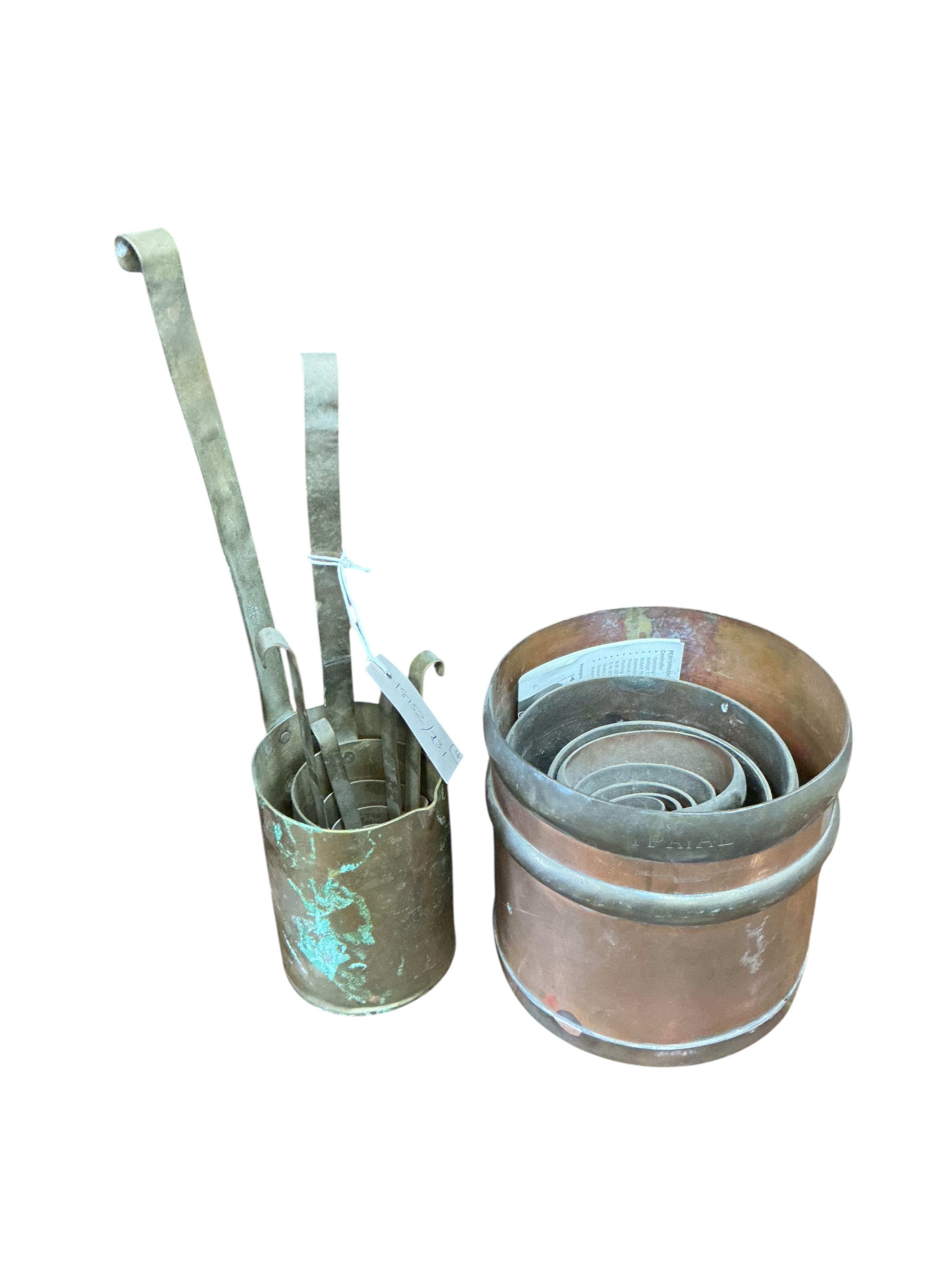 A set of eight Victorian brass and copper graduated bushel measures, one other set of measures, a chopper and a small pine meat safe